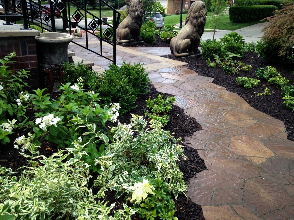 Natural Stone and Statue Garden by Breaking Ground - Photo 11