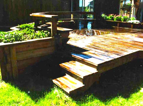 Dark Wooden Deck with Bench by Ganshert Nursery & Landscapes - Photo 2