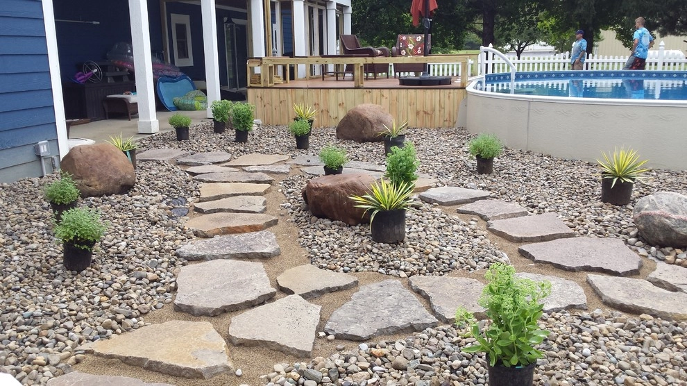 Arwoods backyard pool area by Garden Of Eden Landscaping Services - Photo 4