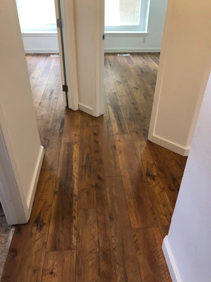 Seamless Laminate Flooring and Baseboards Without Transition Strips by Phoenix Remodeling LLC - Photo 2