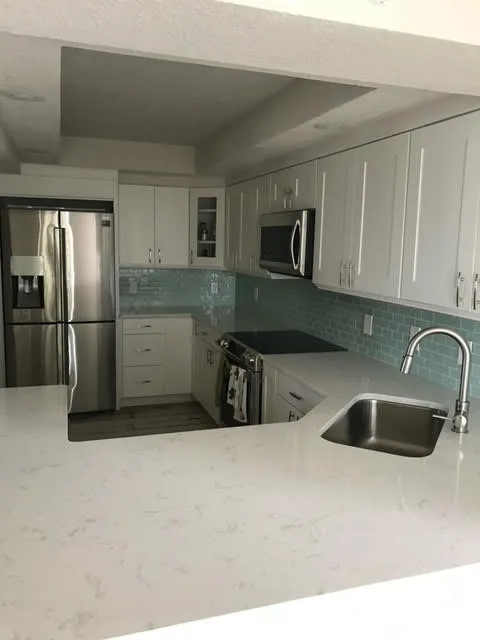 Modern Elegant Kitchens by JSS/Green Planet Construction - Photo 8