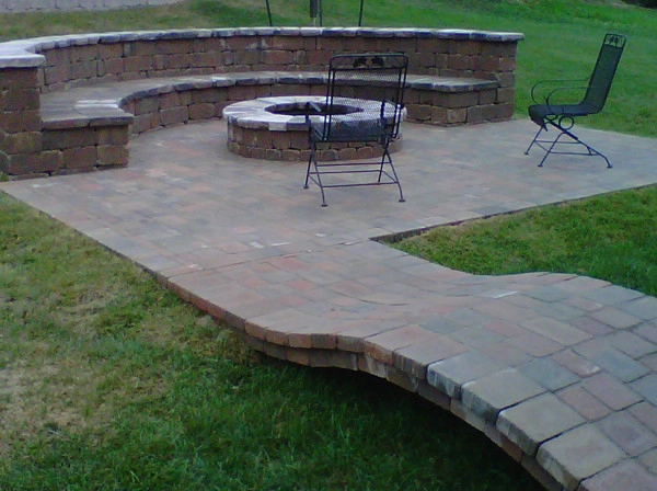 Glorious patio with firepit by Green Way Landscaping Company - Photo 9