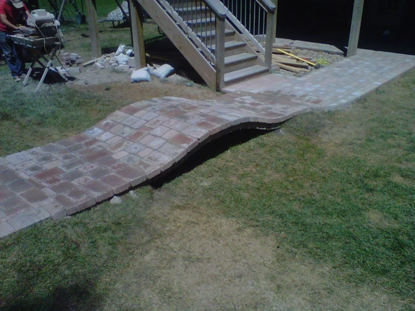 Glorious patio with firepit by Green Way Landscaping Company - Photo 8