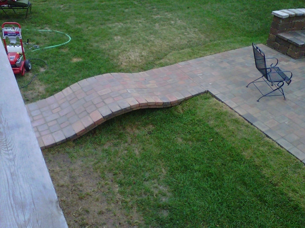 Glorious patio with firepit by Green Way Landscaping Company - Photo 7