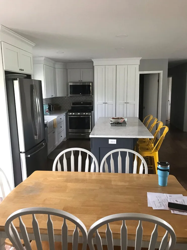 Renovated kitchen, dining area, and living space by HLC Interior Solutions - Photo 13