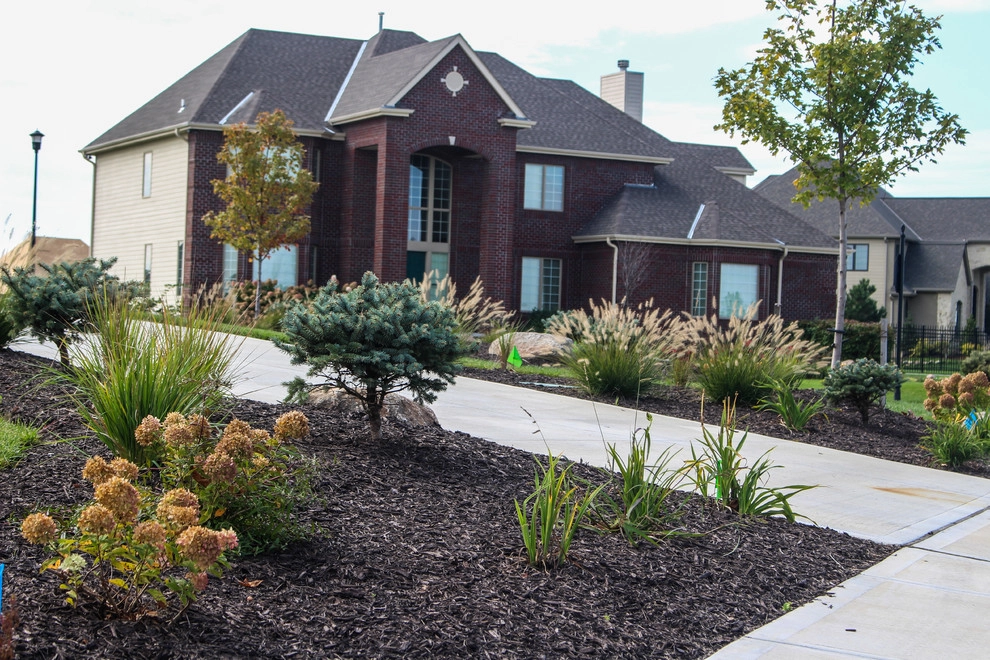Towering Home Landscape With Perfect Lawn by Groundscapes, Inc. - Photo 6
