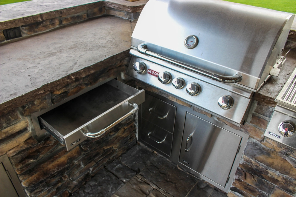 Picturesque Outdoor Kitchen and Patio by Groundscapes, Inc. - Photo 16