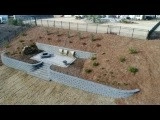 Sloped yard retaining walls with patio / firepit by H2O-Matic Outdoor Creations - Photo 3