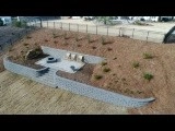 Sloped yard retaining walls with patio / firepit by H2O-Matic Outdoor Creations - Photo 2