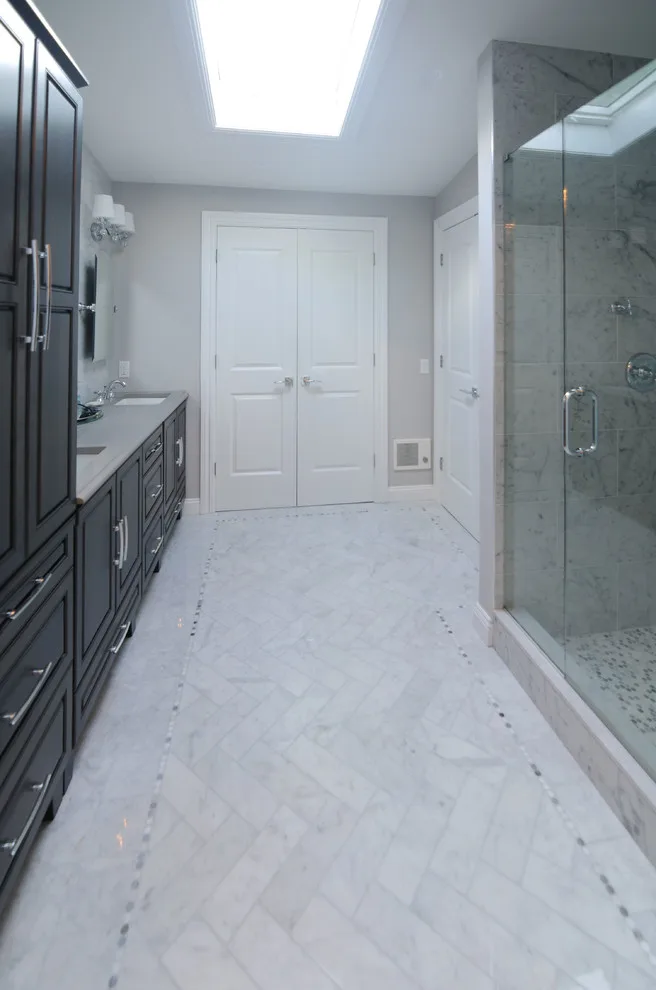 Carrera Marble Restroom by Romancing The Home Interiors - Photo 5
