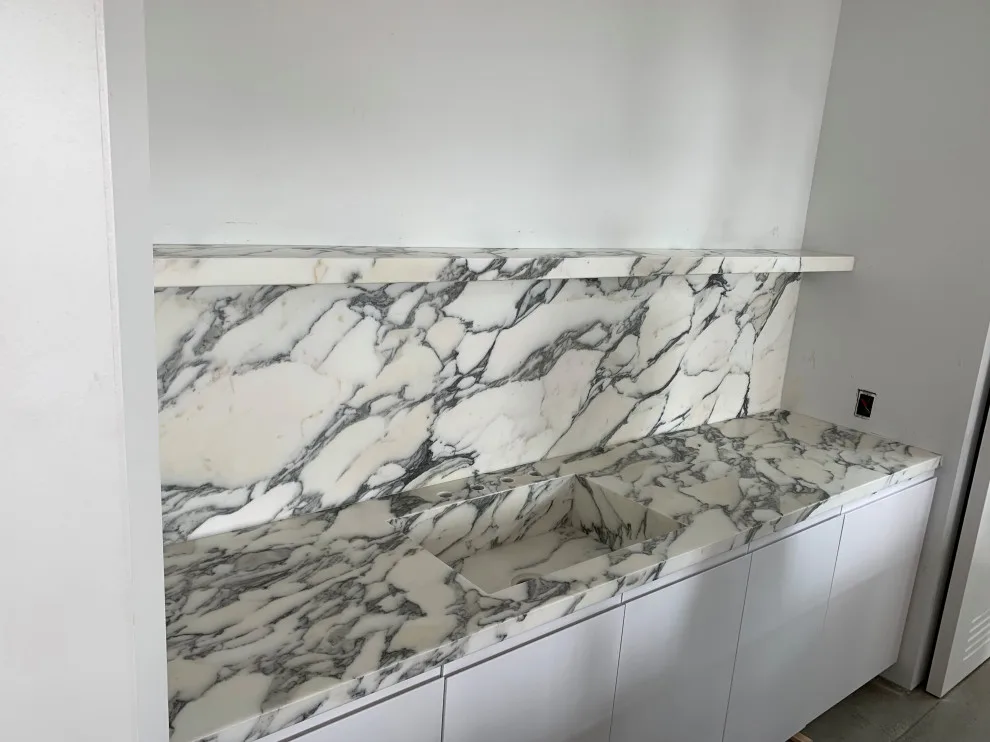 Bespoke marble countertop with integrated sink and complete backsplash for office by CMG Granite And Stone Inc. - Photo 2