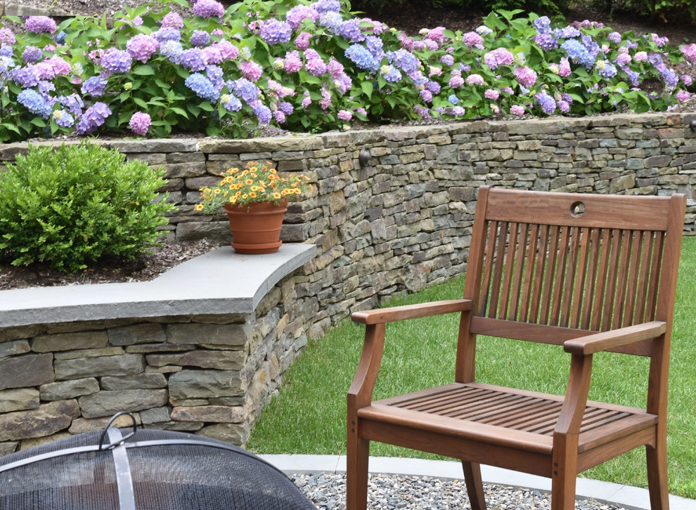 Retaining wall with fire pit seat wall by Bruno Design Associates - Photo 6