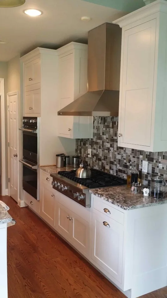 Elegant White Shaker Kitchen Featuring Unique Granite by Stoneworld Tn - Photo 3
