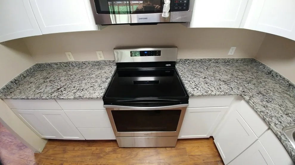 Frosted Bianco Granite Countertops by Tops Solid Surface - Photo 11