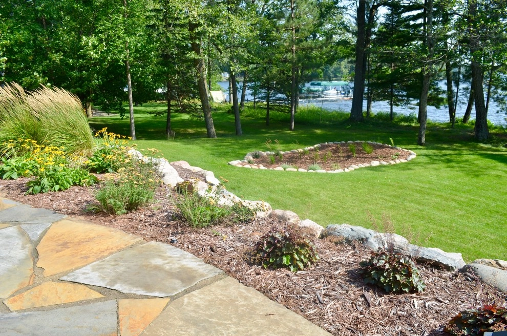 Flagstone patio, retaining wall and rain garden by Landsburg Landscape Nursery - Photo 11