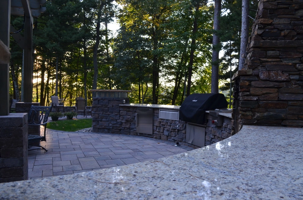 Outdoor kitchen and firepit by Landsburg Landscape Nursery - Photo 3