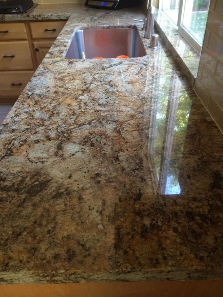 Kitchen Backsplash of Granite and Glass by Family Floors & More - Photo 2