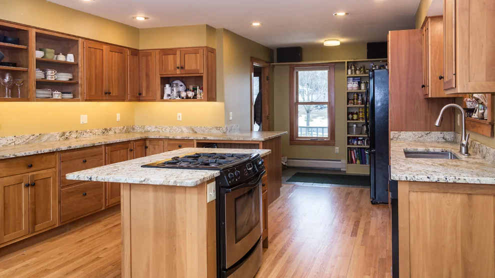 Bordeaux Kitchen with Leathered Typhoon Design by Northern Granite And Marble - Photo 4