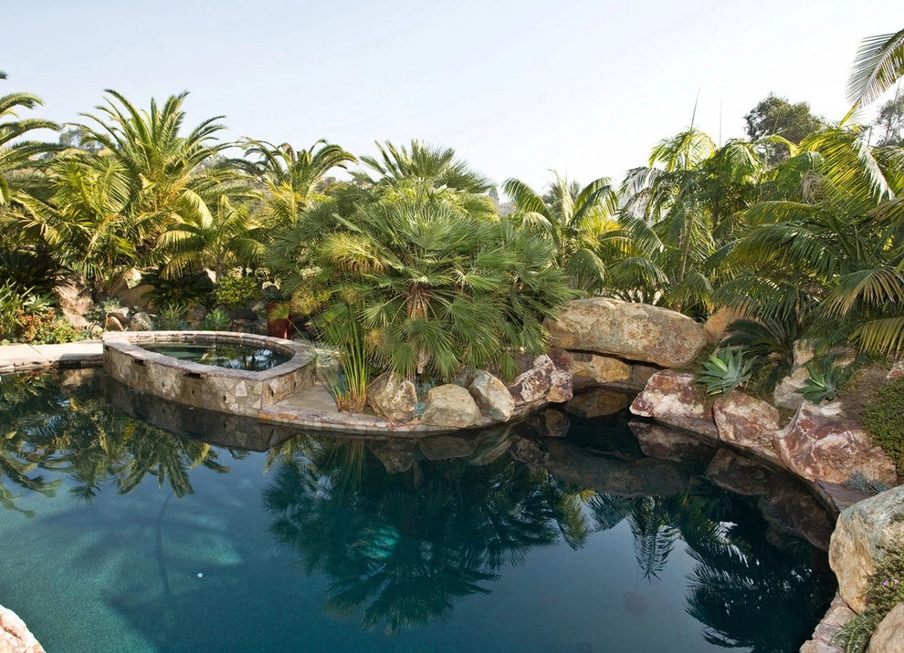 Backyard Landscape Design with Pool, Fireplace, and Custom Stonework by C & H Gardens Artistic Landscape & Tree Service - Photo 5