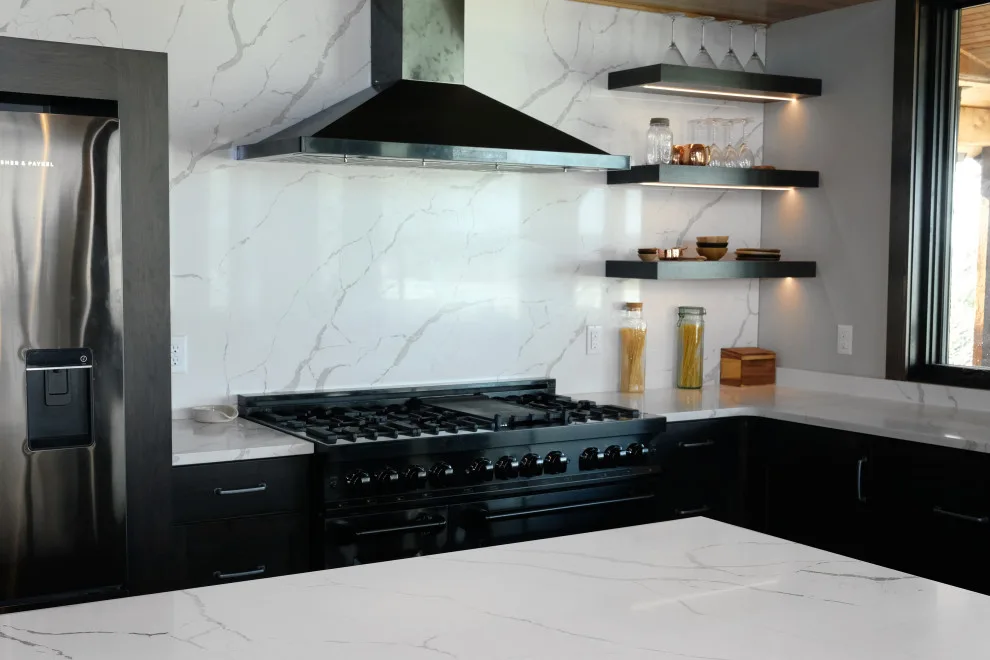 Contemporary Kitchen with Black Cabinets and Marbled Quartz by WilgusIQ - Photo 4