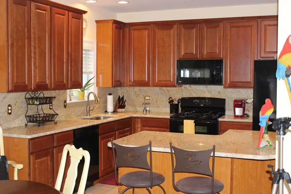 Classic Kitchen with L-Shaped Island and Granite Backsplash by Merlino Marble And Granite - Photo 2