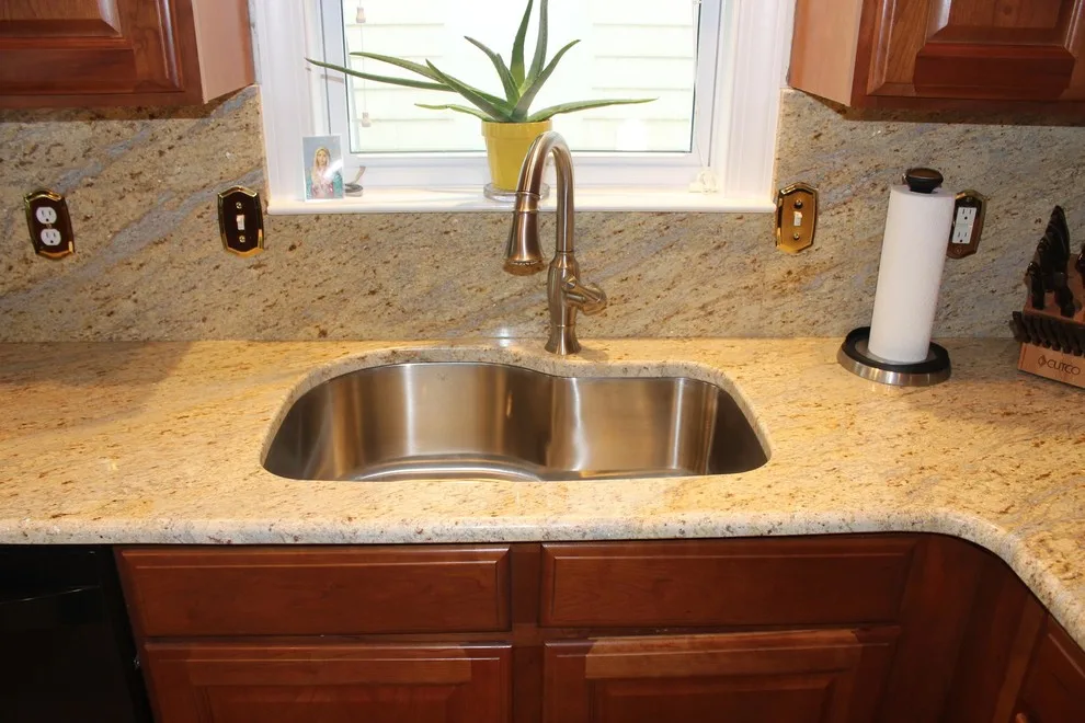 Classic Kitchen with L-Shaped Island and Granite Backsplash by Merlino Marble And Granite - Photo 4