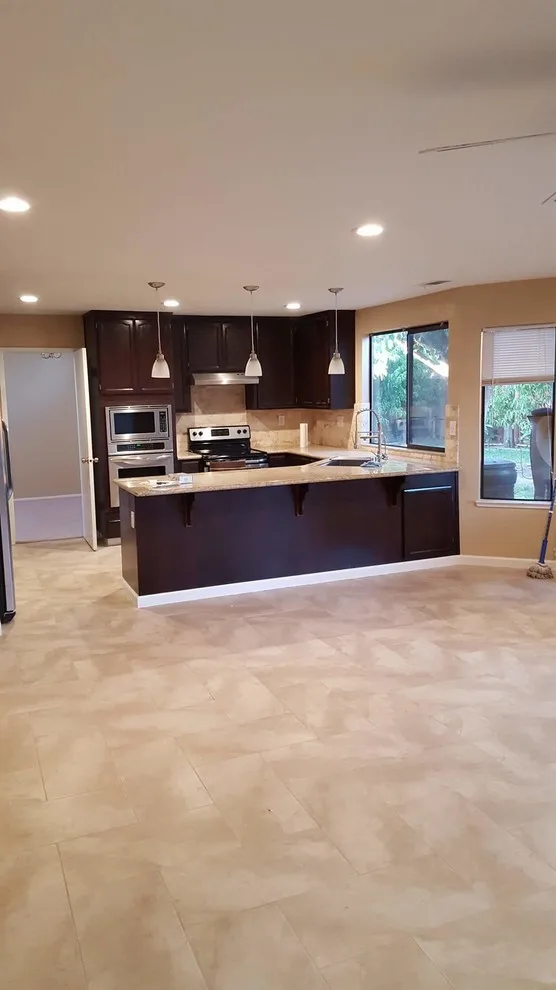 Travertine Flooring with Granite Countertops and Backsplash by StartTile - Photo 2