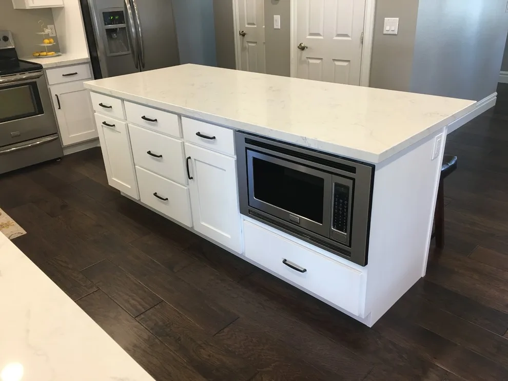 Quartz-Enhanced White Shaker Kitchen with Coordinating Fireplace by PSI Tops | Plastic Specialties Inc - Photo 4