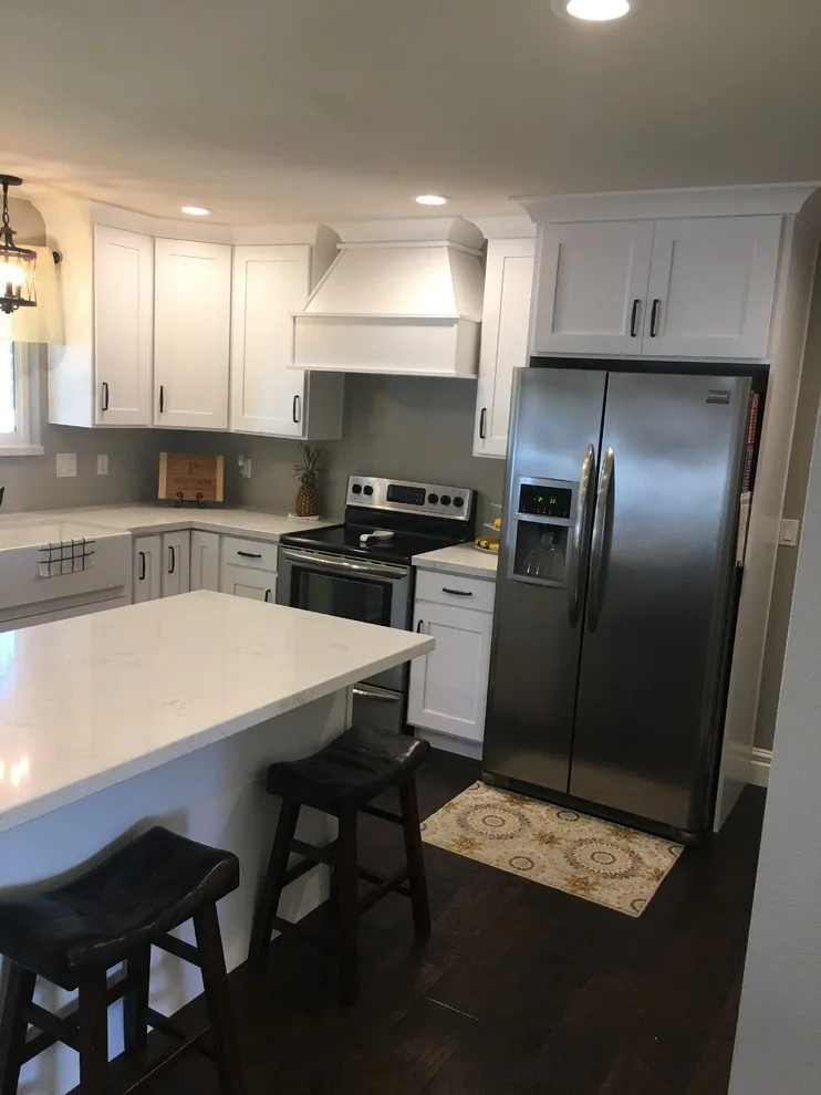 Quartz-Enhanced White Shaker Kitchen with Coordinating Fireplace by PSI Tops | Plastic Specialties Inc - Photo 3