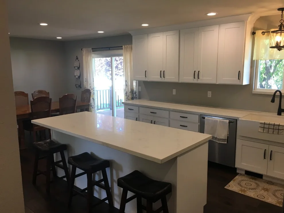 Quartz-Enhanced White Shaker Kitchen with Coordinating Fireplace by PSI Tops | Plastic Specialties Inc - Photo 7