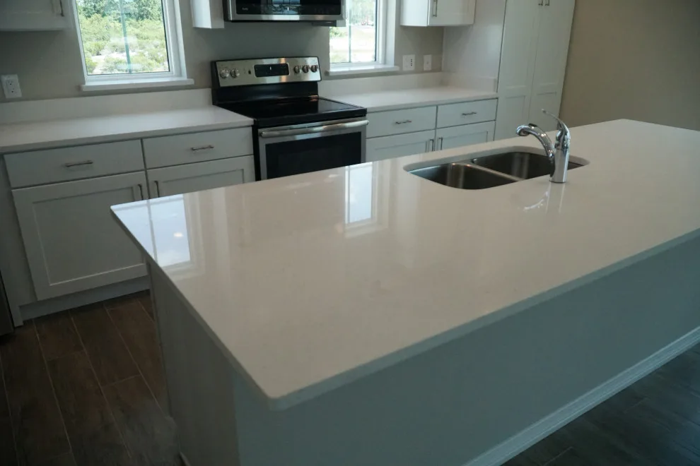 All-White Kitchen Featuring Coordinating Quartz Countertops by Paradise Granite LLC - Photo 2
