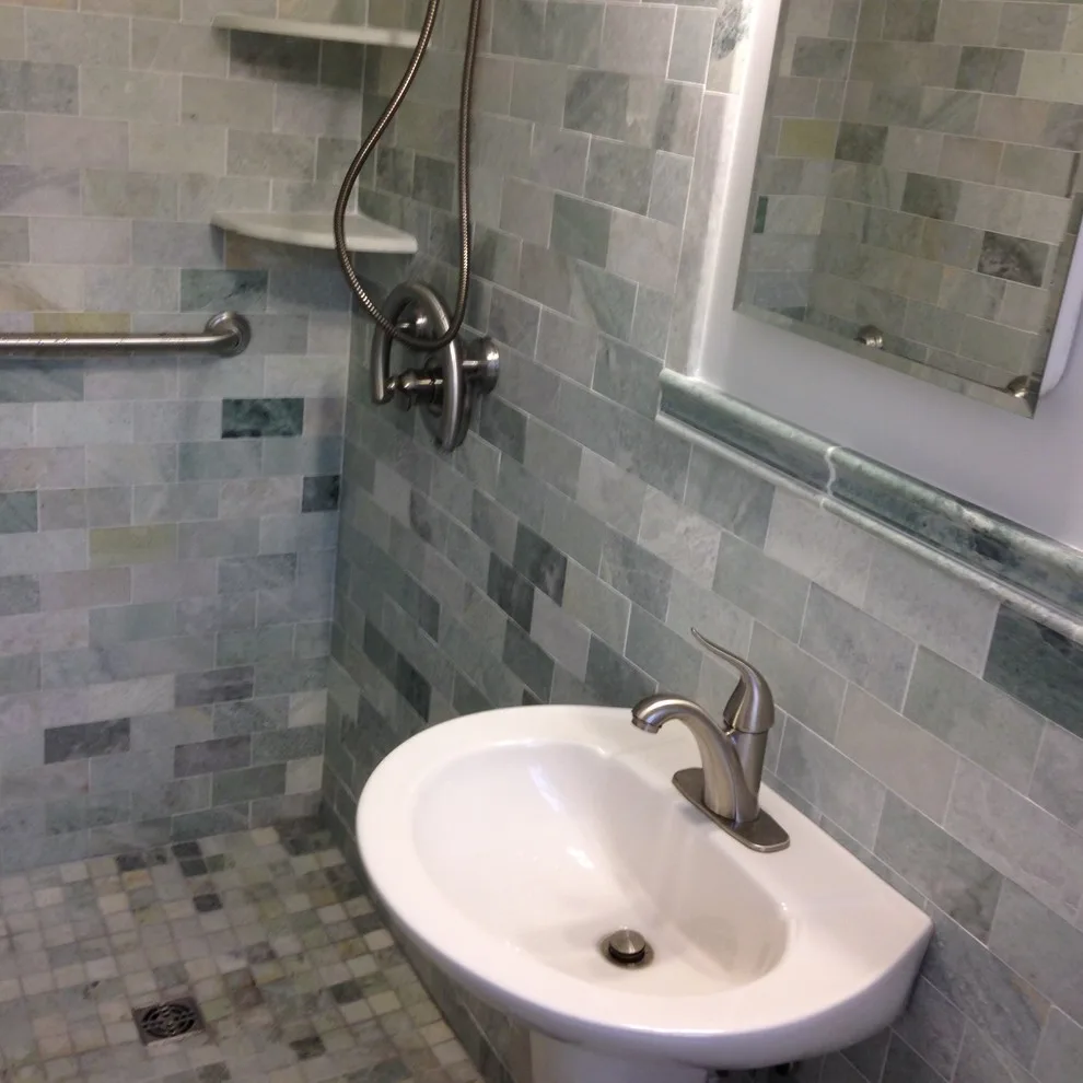 Marble-Tiled Compact Bathroom by Virginia Building And Remodeling - Photo 3