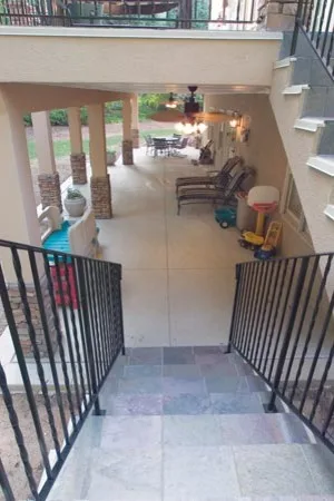 Stucco and Slate Deck and Porch by Lone Star Construction - Photo 9