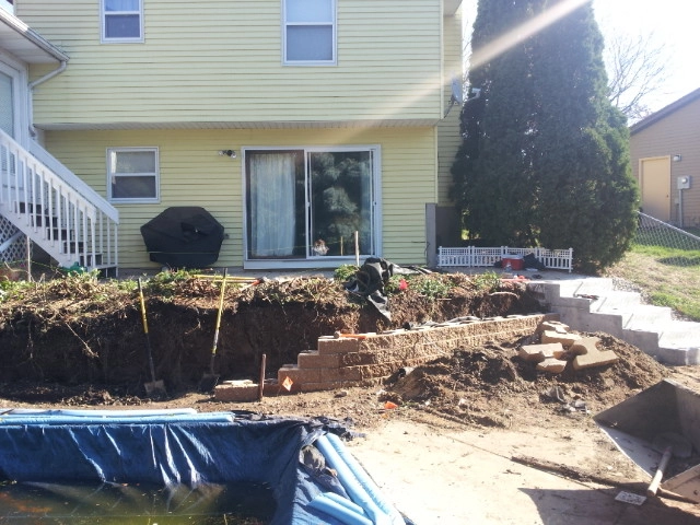 Backyard Pool Retaining Wall by Majestic Services Of Michigan - Photo 3