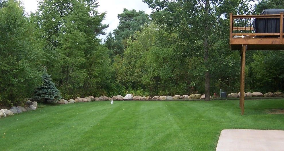 Retaining Wall with Boulders around Yard by Majestic Services Of Michigan - Photo 2