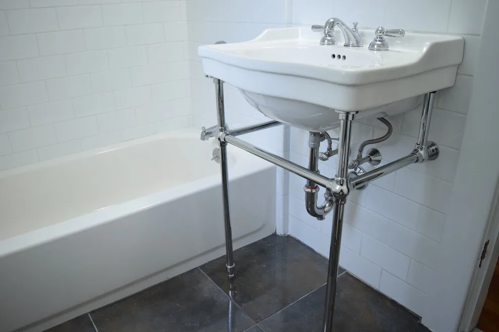 Merrymount Bathroom Renovation with Penny Tiles by Efficiency Plumbing & Remodeling, INC - Photo 2