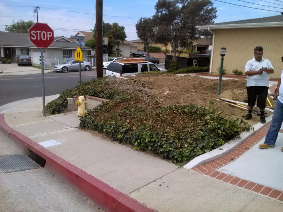 perimeter retaining wall with integrated steps and paver parking area by Natur Landscape Creations - Photo 14