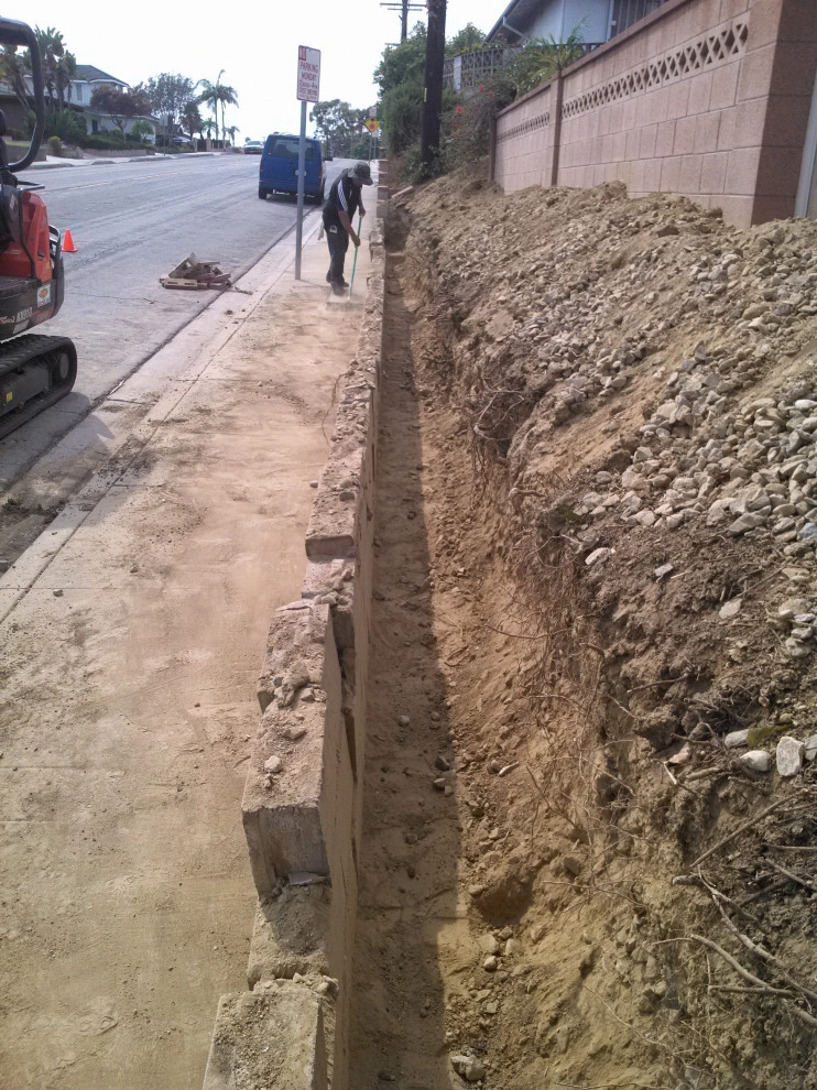 perimeter retaining wall with integrated steps and paver parking area by Natur Landscape Creations - Photo 5