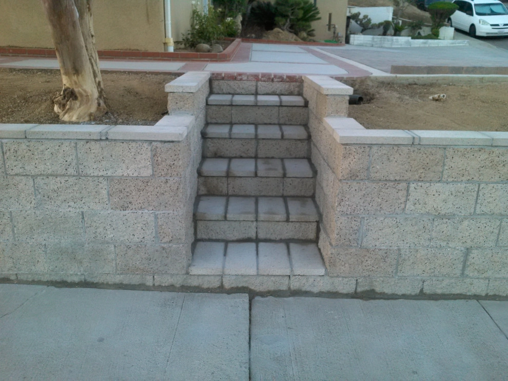perimeter retaining wall with integrated steps and paver parking area by Natur Landscape Creations - Photo 4