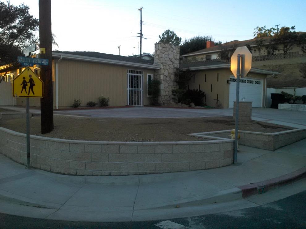 perimeter retaining wall with integrated steps and paver parking area by Natur Landscape Creations - Photo 18