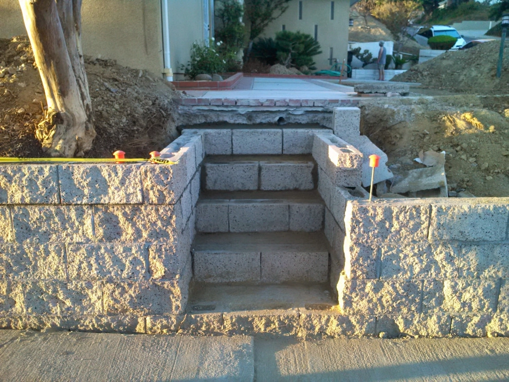 perimeter retaining wall with integrated steps and paver parking area by Natur Landscape Creations - Photo 6