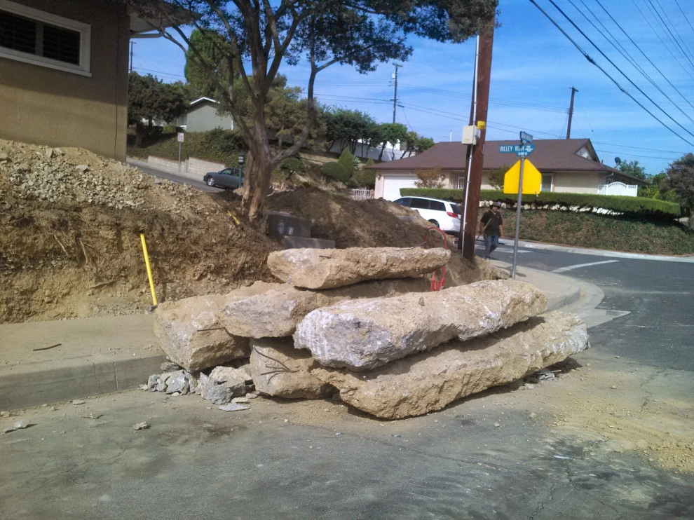 perimeter retaining wall with integrated steps and paver parking area by Natur Landscape Creations - Photo 11
