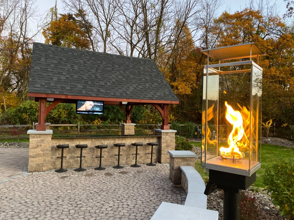 Outdoor living and entertaining space by New Castle Lawn & Landscape - Photo 4