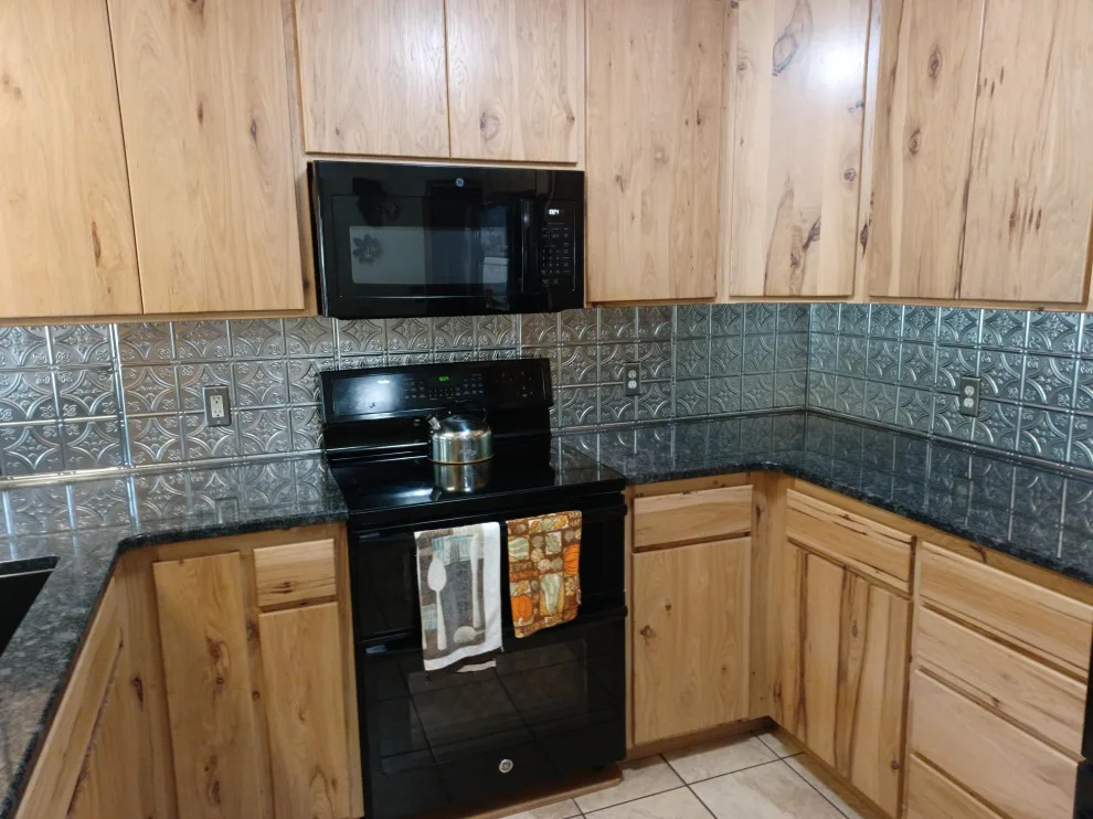 Updated countertop and metal backsplash by SKD Interiors LLC - Photo 2