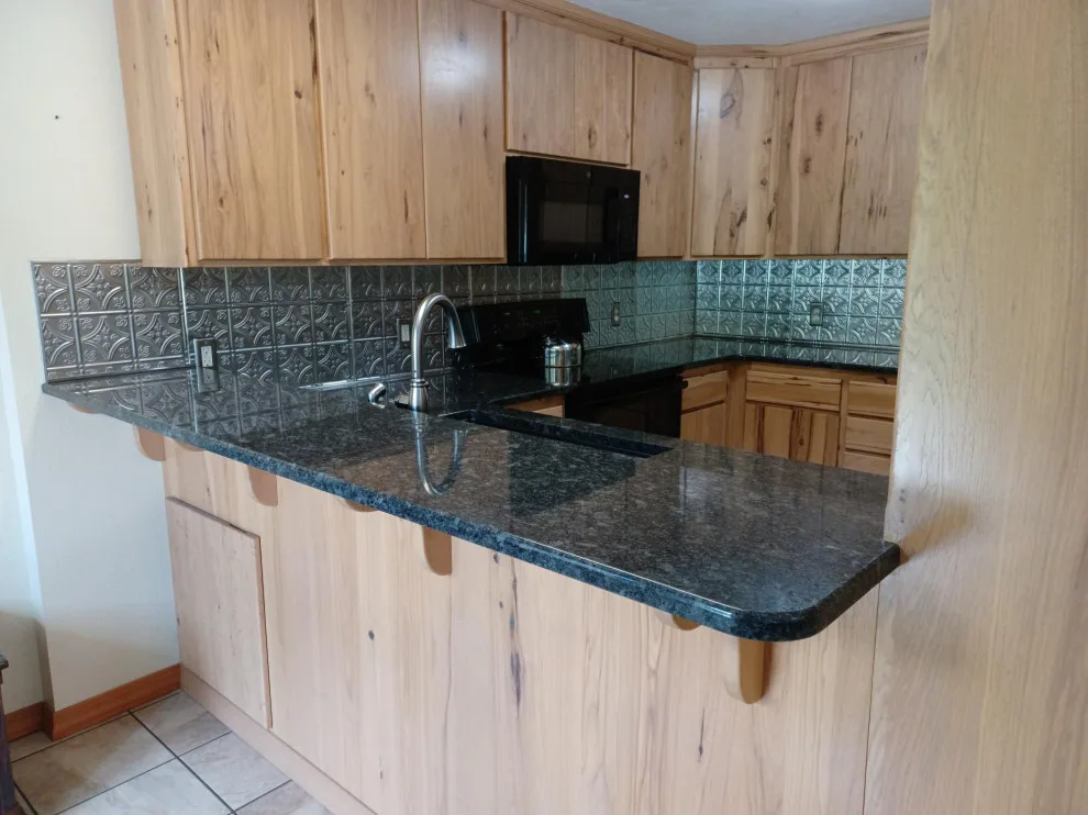 Updated countertop and metal backsplash by SKD Interiors LLC - Photo 3