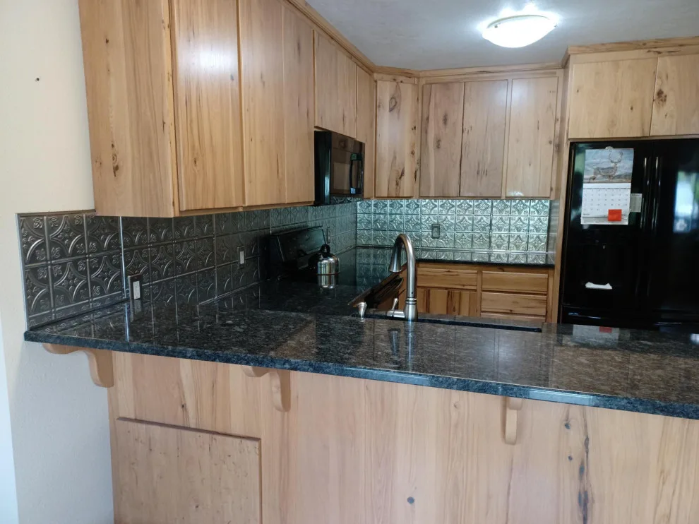 Updated countertop and metal backsplash by SKD Interiors LLC - Photo 4