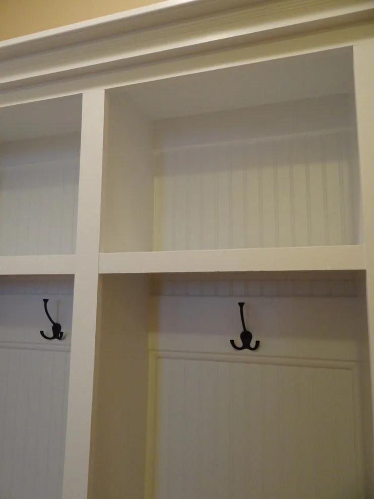 Classic integrated lockers for a mudroom featuring intricate beadboard by DMR Construction - Photo 5