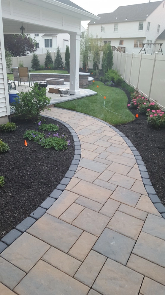 Techo-Bloc Patio Firepit Landscape, Seat wall, Landscape Lighting, Front Entry by Paradise Pavers Pond Landscaping LLC - Photo 2