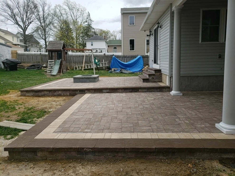 Cambridge Bi-Level Patio with Fire Pit and Landscape Installation by Paradise Pavers Pond Landscaping LLC - Photo 5
