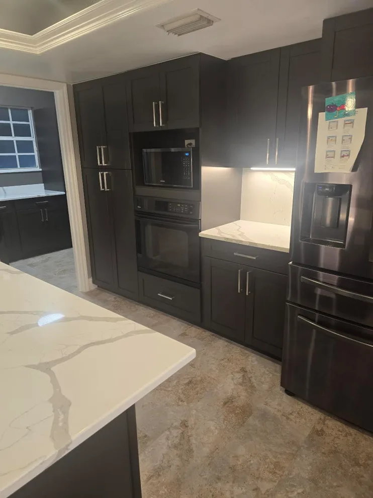 Light Stone and Dark Cabinetry by Level Up Construction & Investment Group LLC - Photo 5